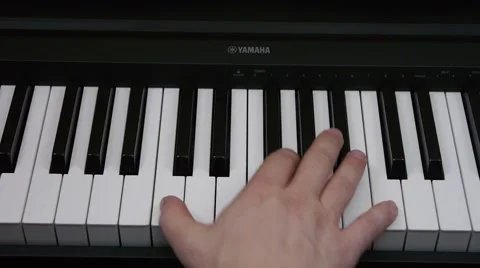 The hand plays the piano Stock Footage 64274644