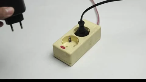 Hand Plug In Electrical Extension Cord Plug Socket to Turn On Power Switch Stock Footage 304130391