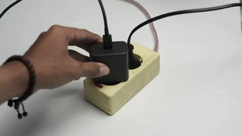 Hand Plug In Electrical Extension Cord Plug Socket to Turn On Power Switch Stock Footage 304130453