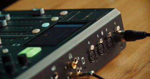 Hand plugging audio cable into professional sound mixer Stock Footage 316248460