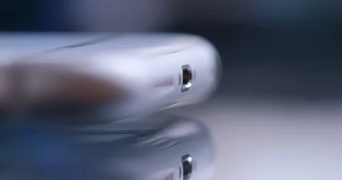 Hand plugging the charger into cell phone. Stock Footage 102039828