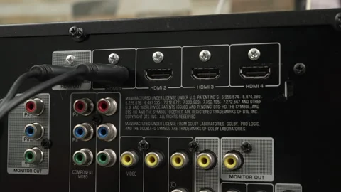 Hand Plugging HDMI Cable Into Home Theater AV HDMI Ports Stock Footage 339077250