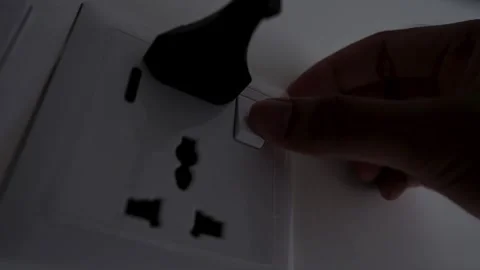 Hand Plugging Power Plug into Wall Socket Stock Footage 317737327