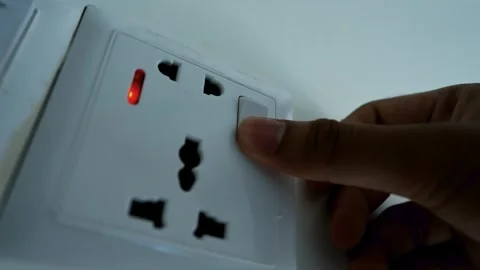 Hand Plugging into Universal Electrical Socket Stock Footage 317737318