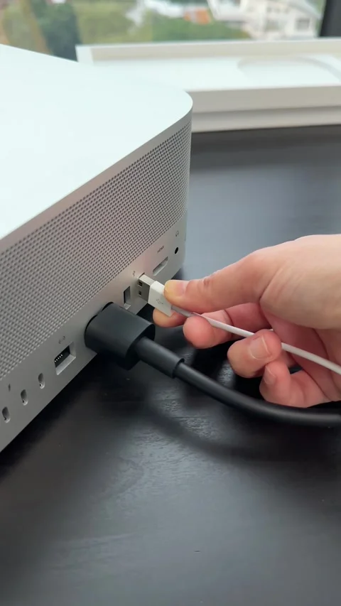 Hand Plugging USB Cable Into Desktop Computer on Desk Stock Footage 318434665