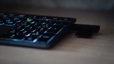 Hand Plugging USB Flash Drive into Backlit Keyboard, Data Storage Concept Vídeo Stock 335467960