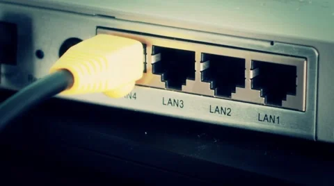 Hand Plugin in Ethernet Cable to a Router Stock-Footage 40666886