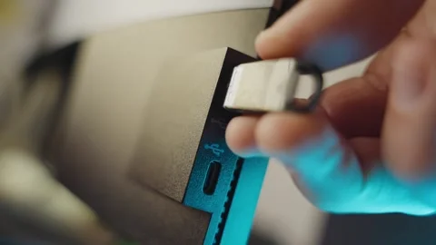 Hand plugs and unplugs memory stick or flash drive device into computer Video stock 335241516