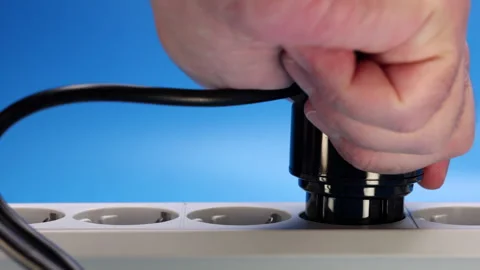 Hand Plugs The Plug With Adapter Into An Extension Cord Socket. 4k, 60 FPS, ProR 스톡 동영상 243904986