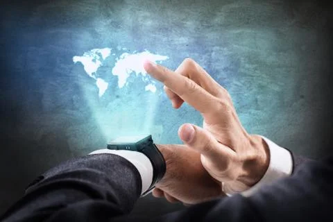 Hand point on virtual map from his smartwatch. Stock Photos