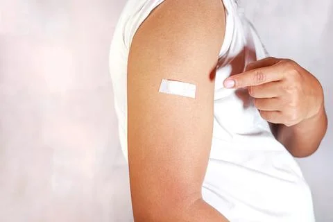 Hand pointing to arm with injection marks Stock Photos