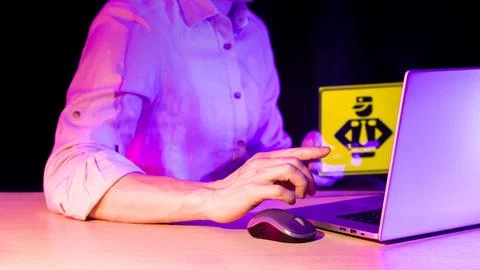 Hand pointing at developer icon near computer Foto stock