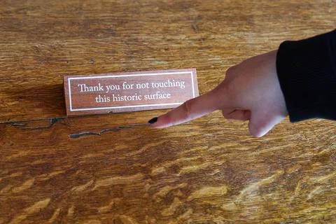 Hand Pointing at Do Not Touch Historic Surface Sign Stock Photos