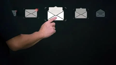 Hand pointing at email icon on digital chalkboard Stock Photos