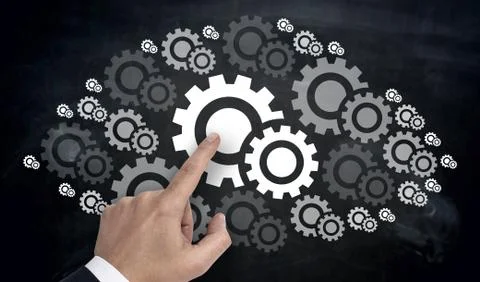 Hand pointing on gearwheel cloud concept Stock Photos