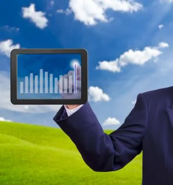 Hand pointing higher graph on tablet pc Stock Photos