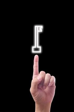Hand pointing to key icon Stock Photos