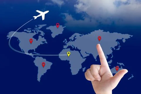 Hand pointing on the map and the plane flying around the world. Stock Photos