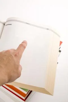 Hand pointing a open book Stock Photos