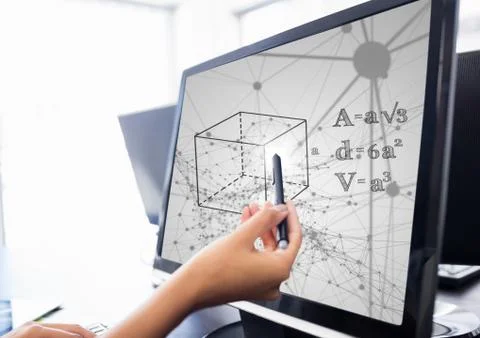 Hand pointing with pen at computer showing black math doodles against grey Stock Photos