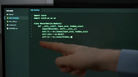Hand pointing at programming code on computer screen. Stock Footage 334040114