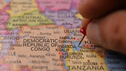 Hand Pointing Rwanda with Red Pin on World Map 4K 60fps Stock Footage 333570816