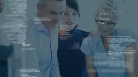Hand pointing tablet showing code while camera pulling back revealing tech team Stock Footage 334744155