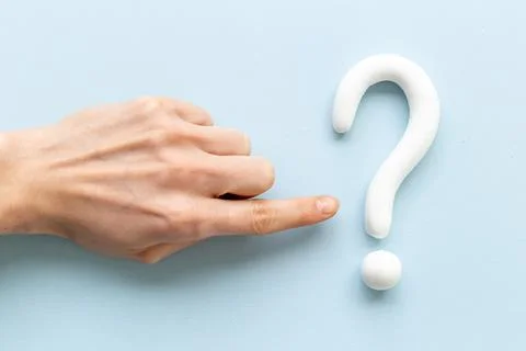 Hand points to question mark sign. Solving problem or search solution concept Stock Photos