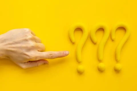 Hand points to question mark sign. Solving problem or search solution concept Stock Photos