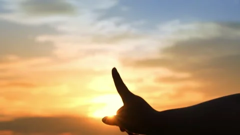 A hand points upward to the sky. Video stock 315750265