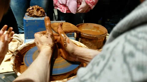 Hand of potter making clay pot Видео 60248335