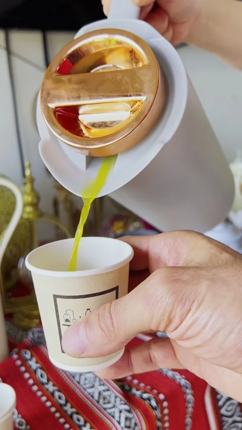 Hand Pouring Arabic Coffee Into Paper Cup Stock Footage 340855786