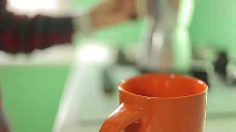 Hand pouring coffee into the cup, close-up Stock Footage 45795452