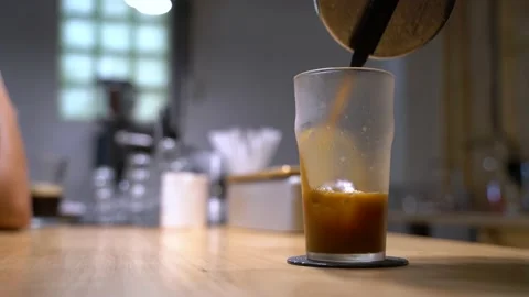 Hand pouring nitro cold brew coffee Stock Footage 137011760
