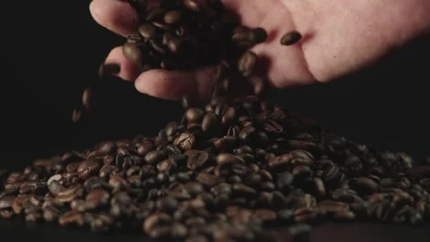 Hand Pouring Roasted Coffee Beans Stock Footage 277217055
