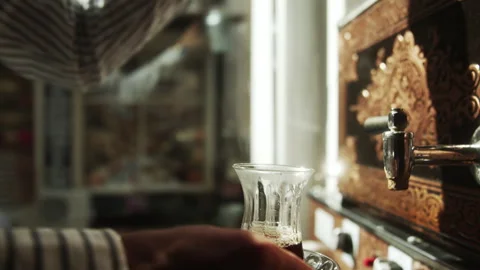 Hand Pouring the Tea in a Cup Stock Footage 268756289