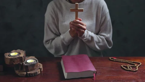 Hand praying and praise with the holy bible in church. young man prayer con.. Stock Footage 336983224
