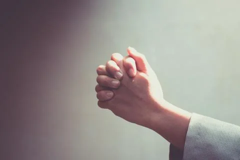 Hand praying Stock Photos