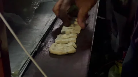 Hand preparing traditional fried dough sticks 動画素材 339531064