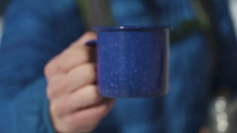 Hand Presenting Cup of Coffee Stock Footage 243121354