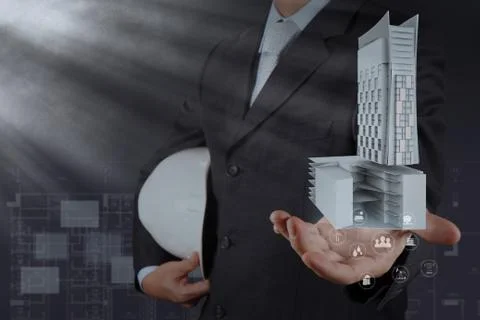 Hand presents building development as concept Ilustración de archivo