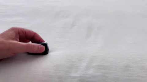Hand Presents Key Car Over Pale Fabric, Simple Access Concept Visual Stock Footage 322895846