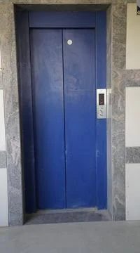 Hand press up button of elevator inside the building for upper high level flo Stock Photos