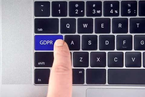 Hand press the button GDPR on keyboard laptop Stock Photos