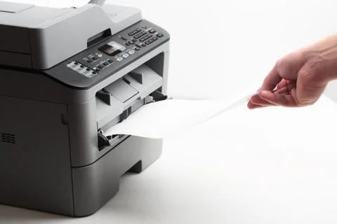 Hand press button on panel of printer. printer scanner laser office copy mach Stock Photos