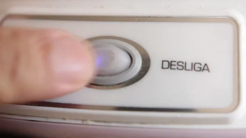 A hand press a button for turning on a household appliance Stock Footage 148056556