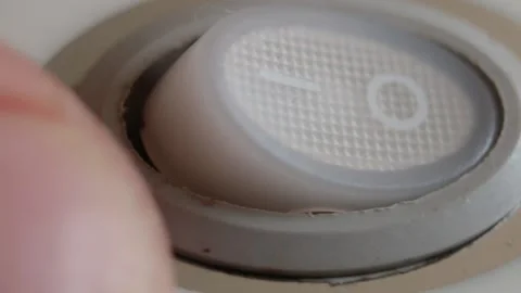 A hand press a button for turning on a household appliance Vídeo Stock 148056905