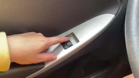 Hand press on car automatic window control. Stock Footage 244719765