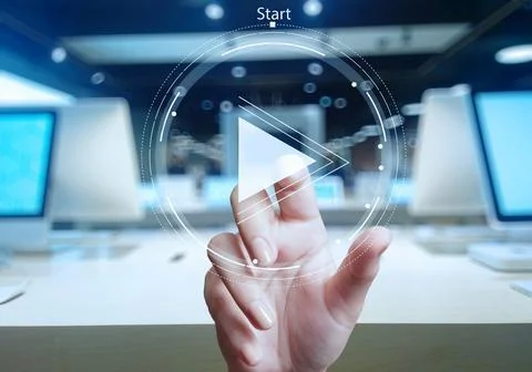 Hand press play button sign to start or initiate projects as concept Stock Photos