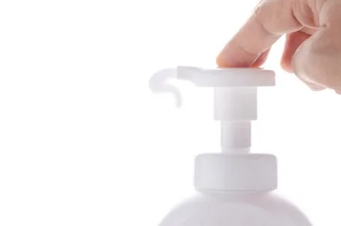 Hand press on pump of bottle with bubble splash Stock Photos